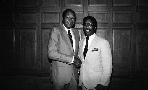 Tom Bradley and Edward Vincent posing together during a fundraising event for the Dunbar Hotel, Los Angeles, 1983