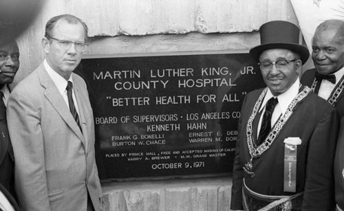 Kenneth Hahn and Harry A. Brewer posing at the cornerstone laying ceremony for Martin Luther King Jr. Hospital, Los Angeles, 1971