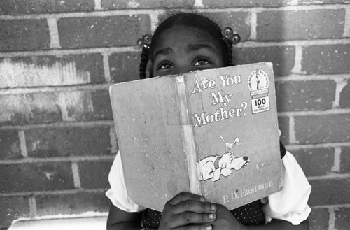 Child Holding Book, Los Angeles, 1983