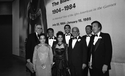 Guests posing together at the California African American Museum exhibit "The Black Olympians," Los Angeles, 1985