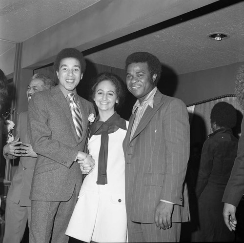 Smokey Robinson and an unidentified couple at a party, Los Angeles, 1971