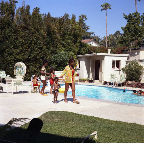 Guests by the pool at Berry Gordy's party, Los Angeles