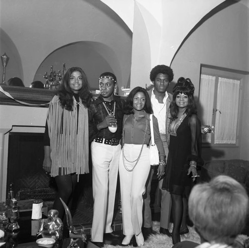 Suzanne de Passe and Anna Gordy posing with others at a party, Los Angeles