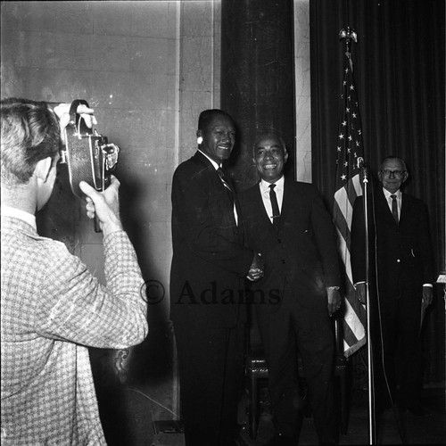 Bradley and Lindsay shake hands, Los Angeles, 1963