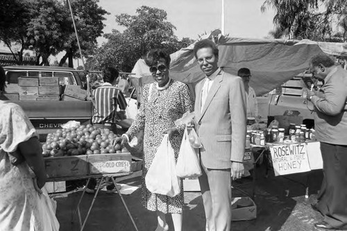 Crenshaw Farmer's Market vendors serving Diane Watson, Los Angeles, 1986