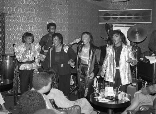 SHE singing group performing at the Pied Piper Club, Los Angeles, 1983