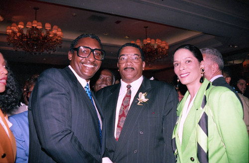 Willie Williams posing with others at an event to welcome him, Los Angeles, 1992