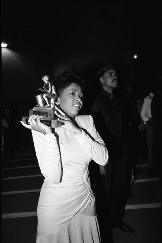 Anita Baker holding her award at the 11th Annual BRE Conference, Los Angeles, 1987