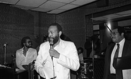 Marvin Gaye talking into a microphone at the Pied Piper nightclub, Los Angeles, 1983