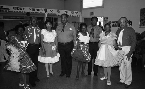 Van Meter Squares dancing group members posing together, Los Angeles, 1989