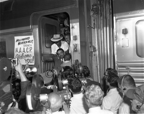 Celes King, III welcoming a displaced Louisiana family, Los Angeles, 1962