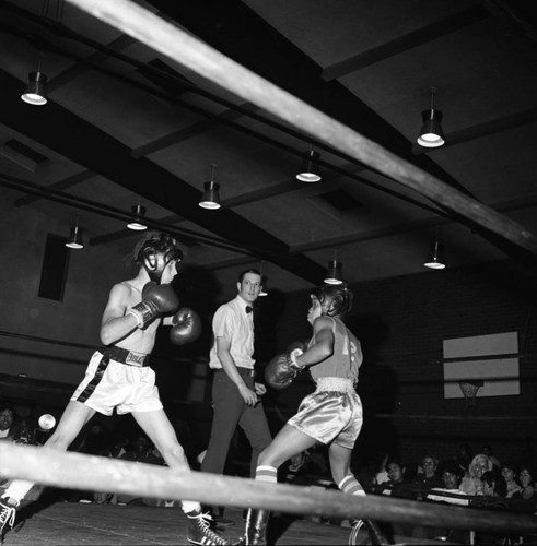 Two young men boxing in the Junior Olympics, Compton, 1973