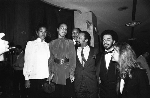 Quincy Jones talking with Peggy Lipton, James Ingram and others at a Neighbors of Watts fundraiser, Los Angeles, 1982