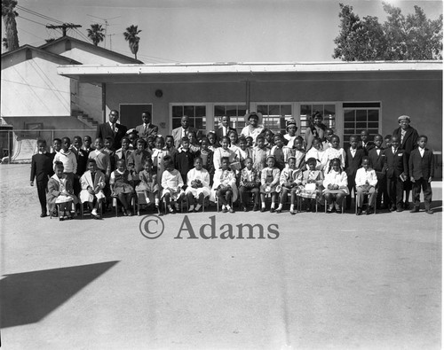 Group of children outside a building, Los Angeles, 1963