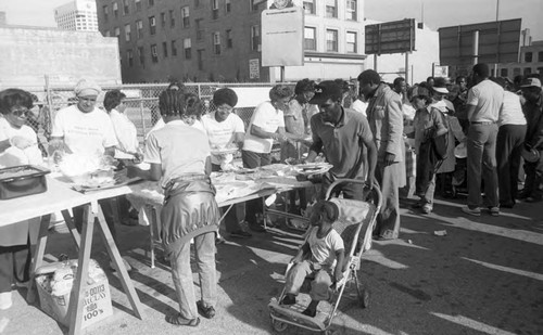 Upper Room Christian Church members serving food on Skid Row, Los Angeles, 1986