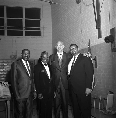 Lionel B. Cade posing with participants of his testimonial dinner, Los Angeles, 1969