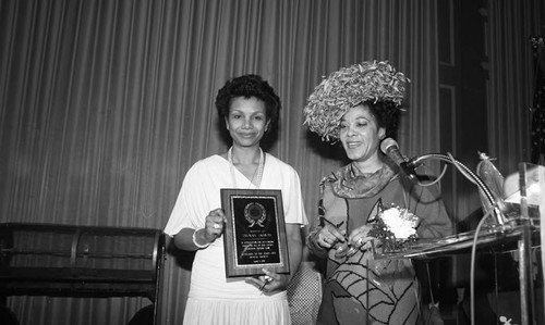 African American woman receiving an award, Los Angeles, 1987