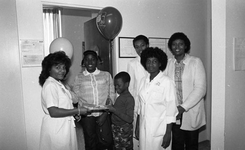 Dotson Medical Corporation health care screening participants posing together, Los Angeles, 1984