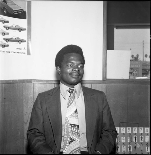 African American automobile salesman posing for a portrait, Los Angeles, 1971