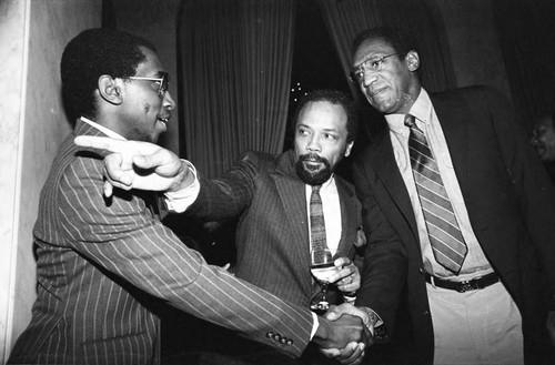 Bill Cosby greeting Greg Phillinganes with Quincy Jones, Los Angeles, 1982