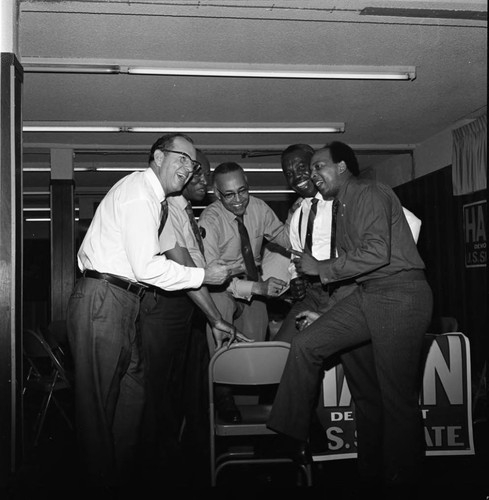 Kenneth Hahn and others talking together during Hahn's campaign for U.S. Senator, Los Angeles, 1970