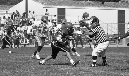 Hawthorne High School playing against Palos Verdes Estates on a football field, Los Angeles, 1986