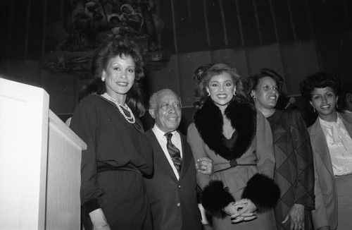 Vanessa Williams, Gilbert Lindsay, Myrlie Evers and others posing together at the NAACP 75th anniversary kick-off celebration, Los Angeles, 1984