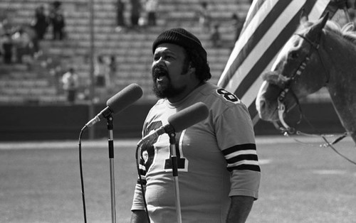 Ronald Townson singing the national anthem at the Urban League's Celebrity All-Star Freedom Classic pre-game, Los Angeles, 1973