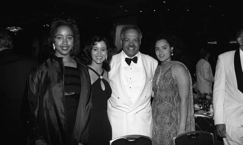 Wayman F. Smith II posing with others during "A Midsummer Night's Magic" dinner, Los Angeles, 1995