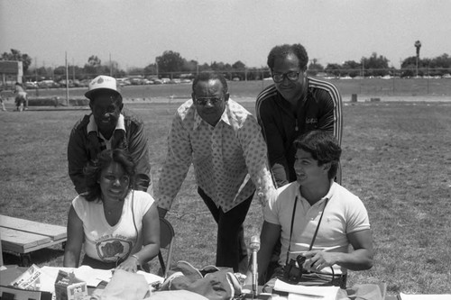 Brad Pye, Jr. posing with Track and Field Championship participants, Compton, 1984