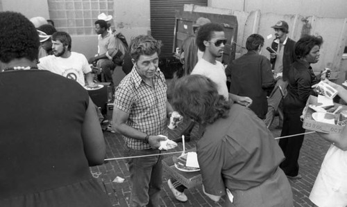 Friends feeding friends, Los Angeles, 1986