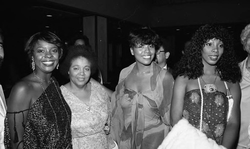 Thelma Houston and Donna Summer posing with others during the NAACP Image Awards, Los Angeles, 1978