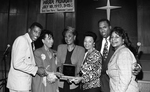 Nancy Wilson posing with her award and others at a "Youth on Parade" event, Los Angeles, 1993