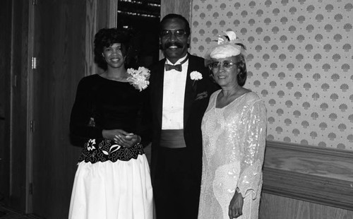 Rev. Wayne S. Davis and Mrs. Wanda Davis standing with an unidentified woman at a First Apostolic Church event, Inglewood, 1986