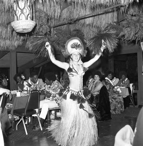 Woman dancing in a Polynesian-style costume, Los Angeles, 1974