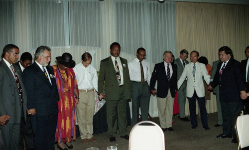 Rev. Jesse Jackson leads a prayer at a protest rally, Pasadena, 1993