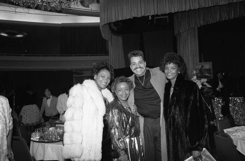 Sinbad posing with others during Black Women's Forum event, Los Angeles, 1989