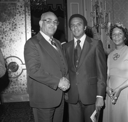 Curtis Tucker posing with Andrew Young at a Brotherhood Crusade dinner, Los Angeles, 1978