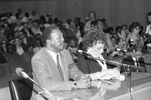 Paul Winfield and Jean Stapleton speaking at a meeting on homelessness, Los Angeles, 1986