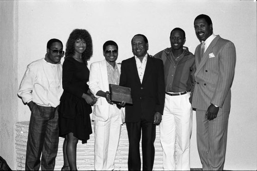 Ren Woods poses with "Pieces of a Dream" and Jerry Robinson at the Pied Piper nightclub, Los Angeles, 1986