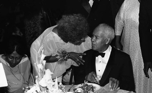 Roy Wilkins talking with a woman at the NAACP Image Awards, Los Angeles, 1978