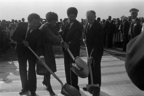 Crenshaw Christian Center ground breaking ceremony participants holding shovels, Los Angeles, 1986