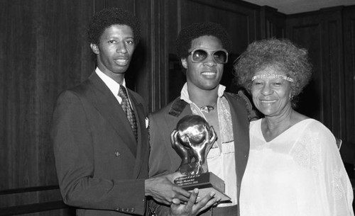 Stevie Wonder holding an NAACP Image Award with Maggie Hathaway, Los Angeles, 1978