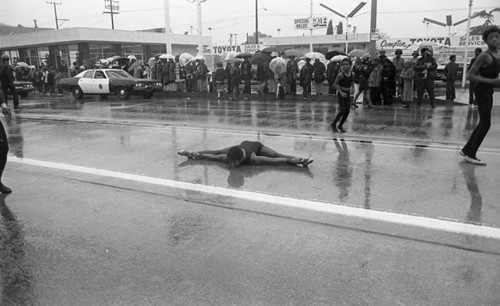 Gymnasts performing in the street during the Compton Christmas Parade, Compton, 1983