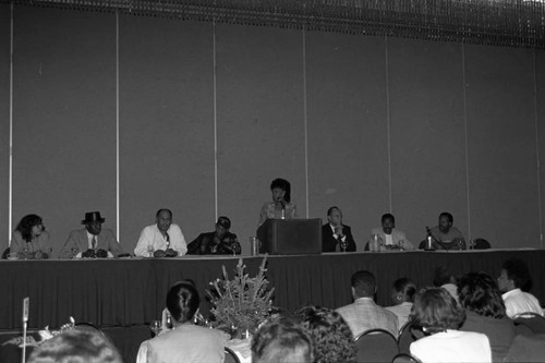 Maxine Waters leading a speaker's panel during a Black Women's Forum event, Los Angeles, 1991