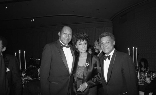 Tom Bradley and Diahann Carroll posing together at an awards dinner, Los Angeles, 1985