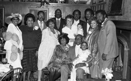 Mrs. Gloria Dupree posing with guests during a 50th anniversary dinner, Los Angeles, 1987