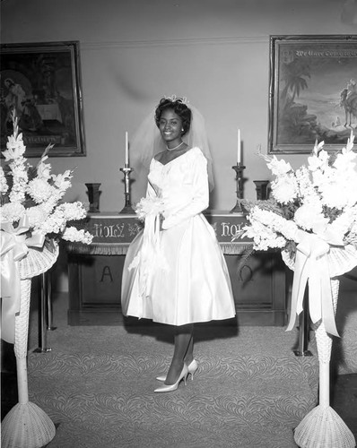 Bryant-Fair bride posing for the photographer, Los Angeles, 1962