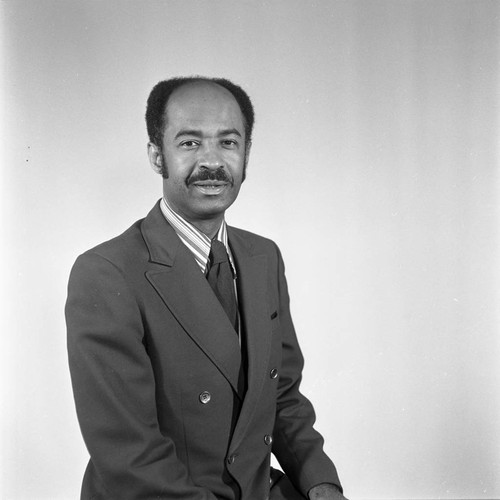 Dr. Abel B. Sykes, Jr. posing for a studio portrait, Compton, 1972