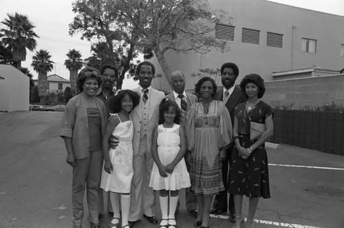 Donald Bohana posing with his family in a parking lot, Los Angeles, ca. 1986